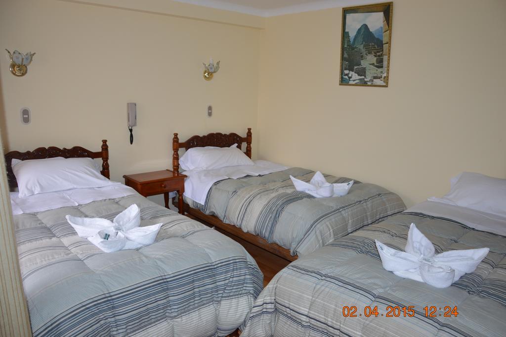 Hostal Huaynapata Куско Номер фото